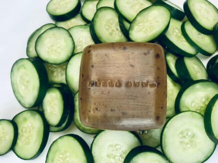 Freckle Face soap surrounded by cucumbers