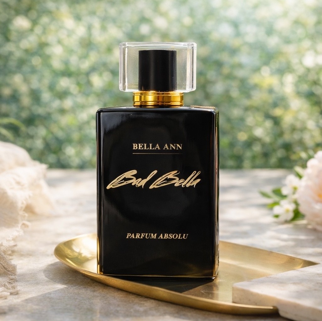 Fragrance from Bella Ann Beautiful bottle with greenery behind